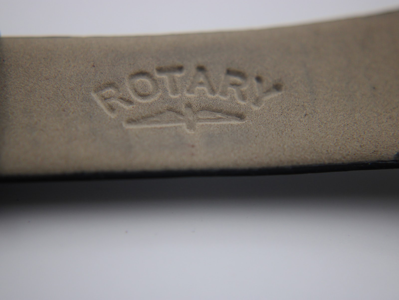 Close-up of the reverse side of the black leather strap, clearly showing the 'Rotary' brand name embossed on the leather.