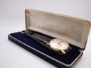 The vintage Rotary watch nestled inside its original dark blue Rotary presentation box with gold lettering.