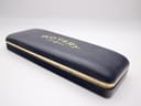 Closed view of the rectangular dark blue original Rotary presentation box with gold-tone accents and 'Rotary' logo.