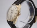 Angled side view of the Roamer Superking watch showing the gold-tone case, crown, and light wear on the side.