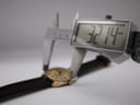 Digital caliper measuring the case diameter of the Roamer Superking watch, displaying 32.14 mm.