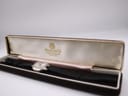 Bulova Accutron watch displayed inside a non-original brown velvet presentation box.