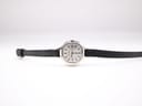 Full front view of the Bulova Accutron watch with black leather strap laid flat.