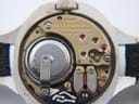 Close-up of the Bulova Accutron Cal. 2300 electric movement with 13 jewels and battery compartment visible.