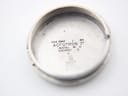 Inside view of the watch case back, showing "USE ONLY ACCUTRON" and other inscriptions.
