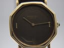 Close-up front view of the Raymond Weil Genève watch dial, showing the gilt baton indices, Roman numerals at XII and VI, and minimalist two-hand layout.