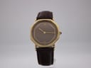 Front view of the Raymond Weil Genève watch, focused on the brown dial, gold case, and new brown leather strap.