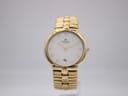 Front view of the Raymond Weil Genève 9154 gold plated watch with a white dial and gold Roman numerals.