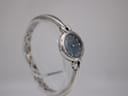 Slightly angled side view of the Michel Herbelin watch, highlighting the shiny stainless steel bangle and dial.