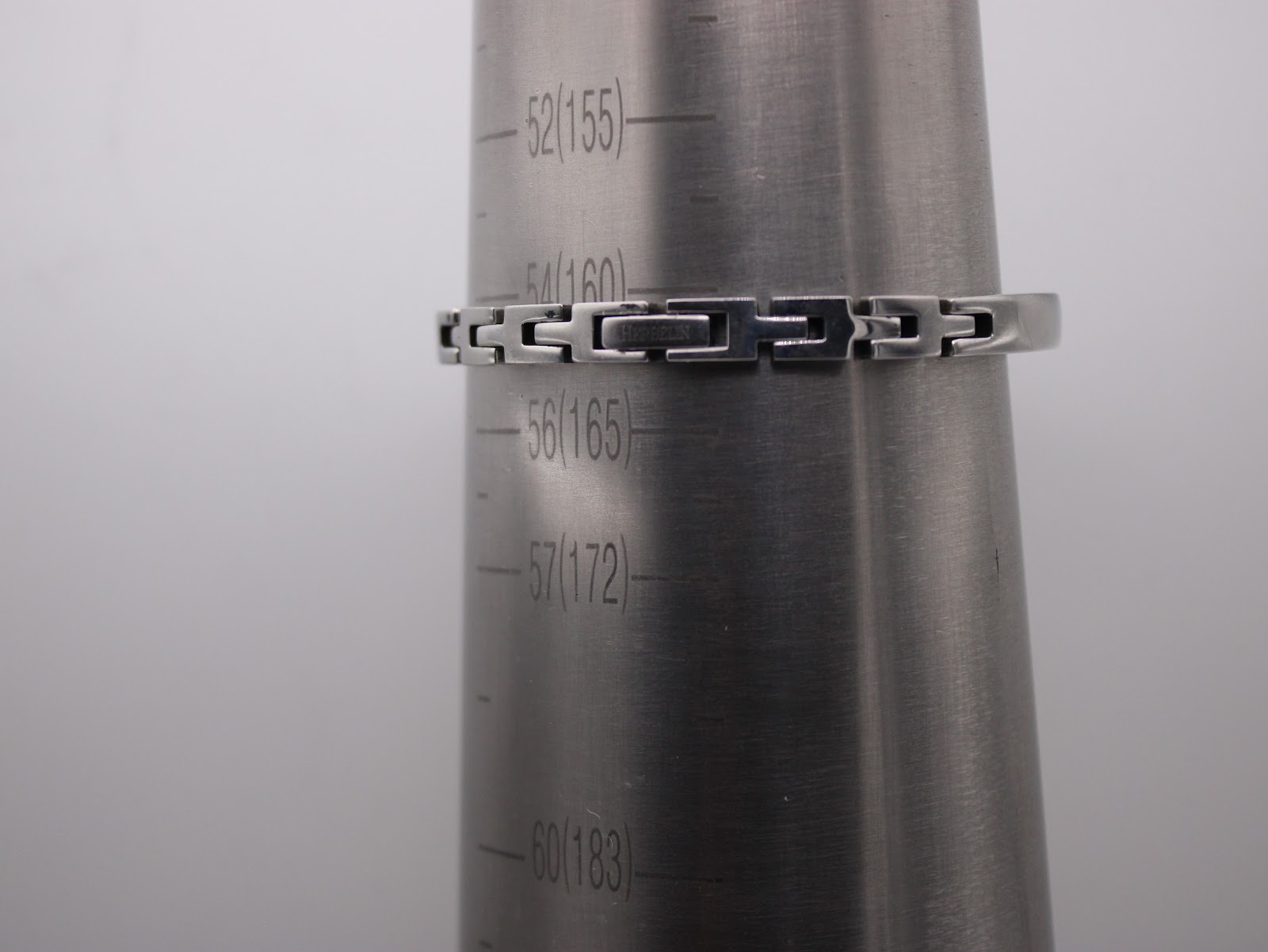 Watch bracelet on a wrist sizing mandrel, indicating a fit of approximately 160mm.