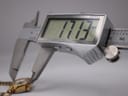 Digital caliper measuring the watch case diameter at 17.13 mm.