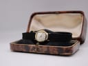 The Bifora watch displayed in an open, vintage brown presentation box with a cream interior.