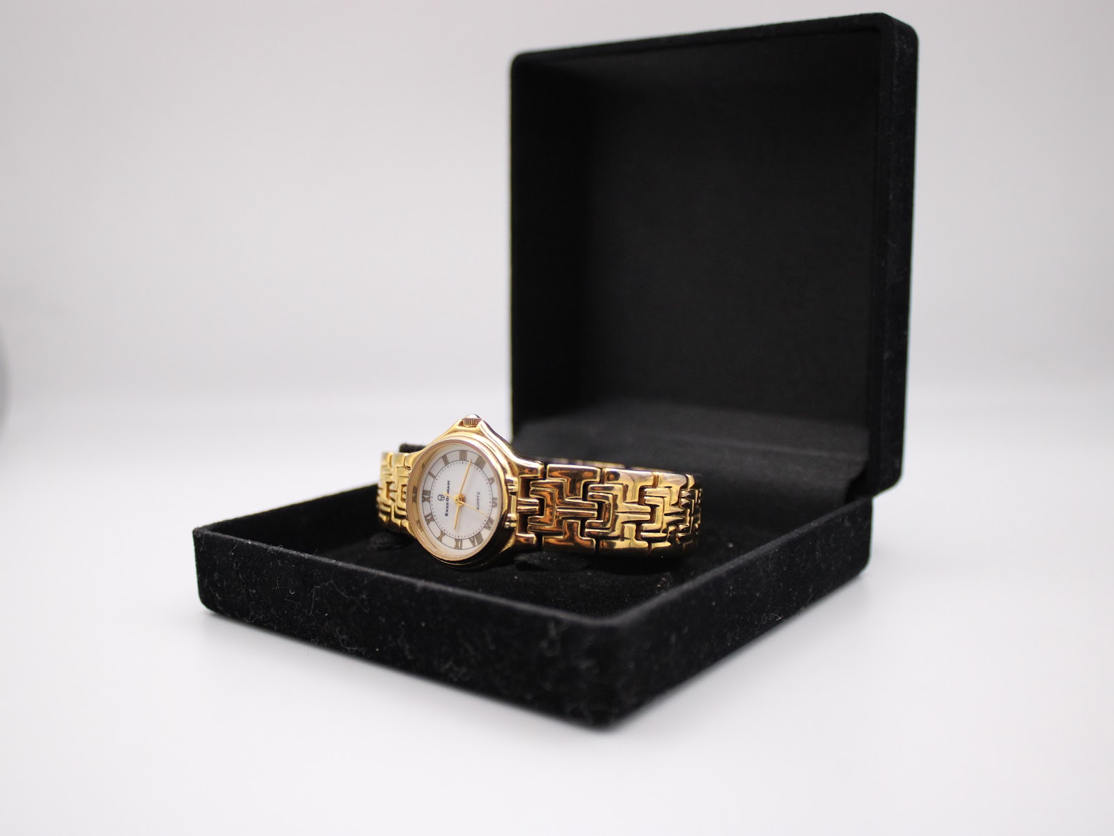 The Enzo Giovanni watch resting inside a generic black presentation box.