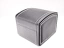 Exterior view of the black faux leather travel box with distinctive white stitching on the edges.