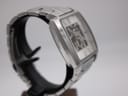 Opposite side quarter view of the watch, showing the brushed and polished finishes of the stainless steel case and bracelet.