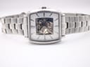 The watch laid flat, showcasing the full length of the stainless steel bracelet and the square case design.