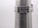 Stainless steel bracelet closed on a wrist sizing cone, showing the wrist circumference at approximately 160mm.