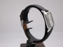 Opposite side profile view of the Emporio Armani AR-0413 watch on a stand, showing the sleek case design and strap.