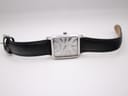 Overhead view of the Emporio Armani AR-0413 watch lying flat, displaying the full length of the black leather strap and rectangular case.