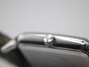 Detailed close-up of the push/pull crown on the Emporio Armani AR-0413, featuring the etched Emporio Armani eagle logo.