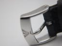 Close-up of the original stainless steel pin buckle of the Emporio Armani watch, showing the embossed eagle logo.