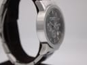 Opposite side view of the watch case, showing the brushed finish of the stainless steel.