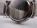 Close-up of the polished stainless steel case back, engraved with "ROCHA JOHN ROCHA ALL STAINLESS STEEL 7192-63 JAPAN MOVEMENT 5ATM".