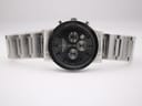 Front view of the watch with its stainless steel bracelet laid flat, showcasing the full length.