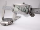 Digital caliper measuring the watch case diameter at 40.00mm, with the watch partially visible in the background.