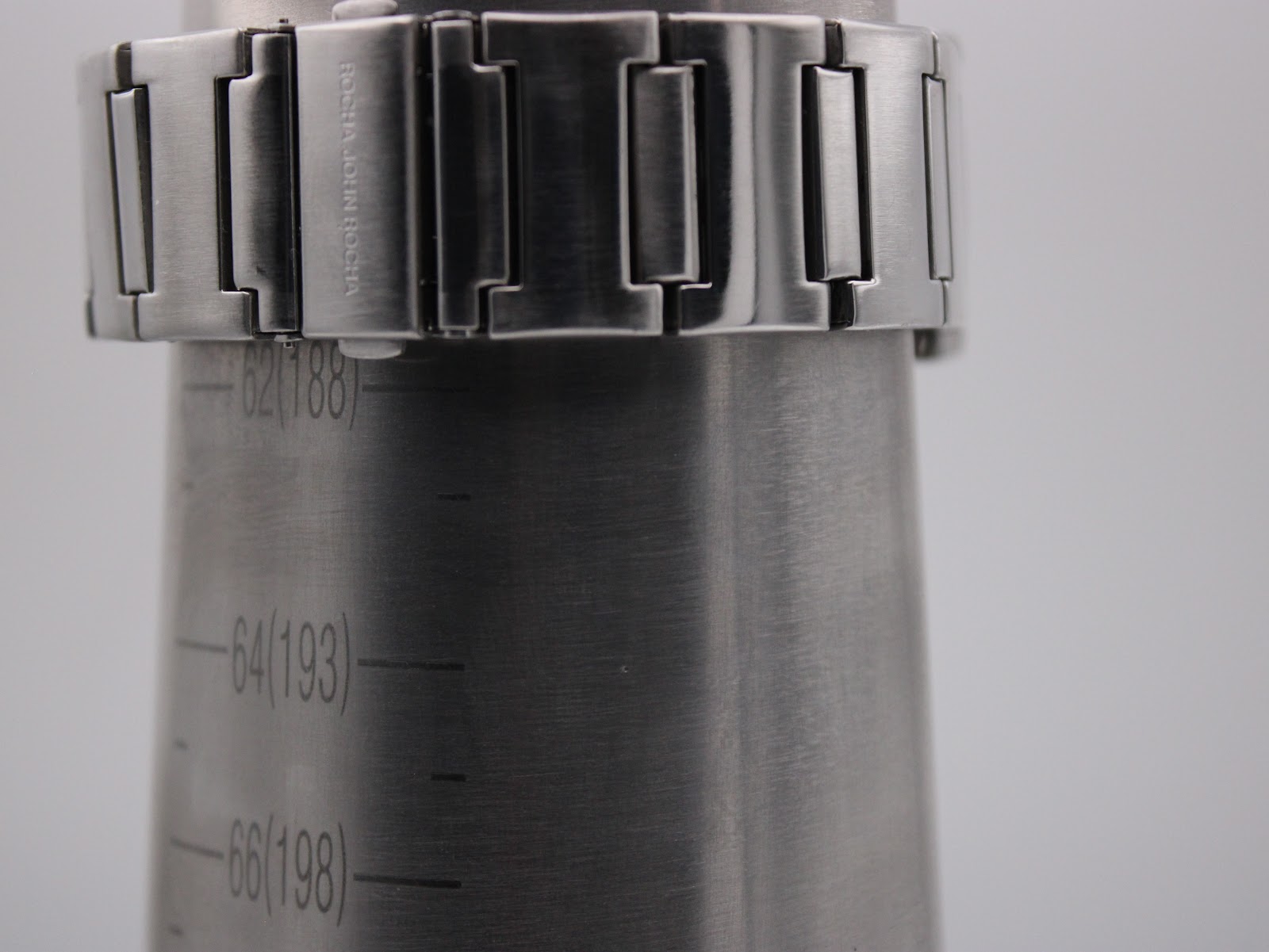 Close-up of the stainless steel bracelet on a wrist sizing gauge, showing a circumference of approximately 188mm.