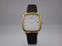 Front view of gold-plated Citizen Eco-Drive square watch with white dial and brown leather strap.
