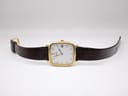 Full view of the Citizen watch laid flat, showing the brown crocodile-grain leather strap and buckle.