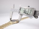 Digital caliper measuring the case diameter of the watch, displaying 36.31 mm.