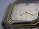 Close-up angled view of the Bulova P2 dial showing Roman numerals, brand name, and visible scratches on the mineral crystal.
