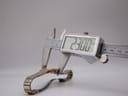 Digital caliper measuring the Bulova P2 watch case, displaying a precise diameter of 23.00mm.