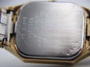 Close-up of the stainless steel case back, engraved with "Bulova P2", "Base Metal Bezel", "Stainless Steel Back", "Water Resistant", and serial number.
