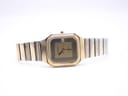 Angled front perspective of the Bulova P2 watch with its gold tone bracelet laid out.