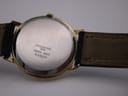 Close-up of the watch's stainless steel case back with engravings 'Stainless Steel Back Swiss Made 59328'.