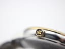 Macro shot of the gold-tone crown with the Dreyfuss emblem.