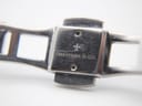 Close-up of the two-tone stainless steel bracelet clasp, signed "DREYFUSS & Co.".