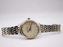 Full view of the watch lying flat, showcasing the dial and bracelet.