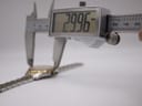 Digital caliper measuring the watch case diameter at 29.96mm.