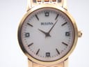 Close-up of the Bulova watch dial, clearly showing the mother of pearl texture, diamond indices, and rose gold-tone hands.