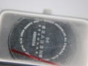 Macro close-up of the Skagen watch case back, revealing engraved details including "SKAGEN DENMARK", "459SSXM", "ALL STAINLESS STEEL", "JAPAN QUARTZ", and "3ATM WR".