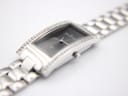 Angled close-up of the watch case and bracelet, focusing on the crystal-set rails and the polished finish of the stainless steel links.