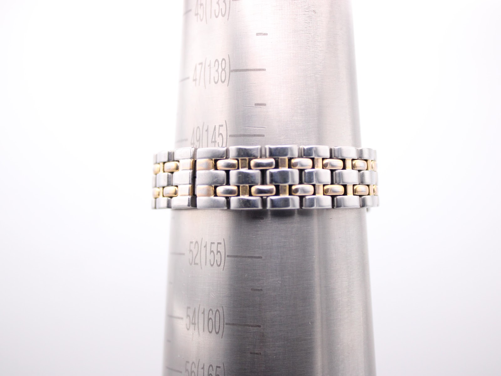 Watch bracelet on a sizing cone, showing wrist fit measurement.