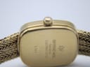 Close-up of the case back of the Raymond Weil 5707, showing 'Raymond Weil Genève', '18K Gold Electroplated', and '5707' engravings.