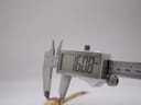 Close-up of a digital caliper measuring the watch case, displaying a precise reading of 16.08 mm.