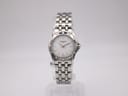 Front view of Raymond Weil Tango ladies watch with silver dial and stainless steel bracelet, on a clear display stand.