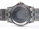 Close-up of the watch case back, detailing engravings like 'Raymond Weil', 'Tango', 'Swiss Made WR 5ATM', 'Stainless Steel', 'Sapphire Crystal', and serial number V305635.